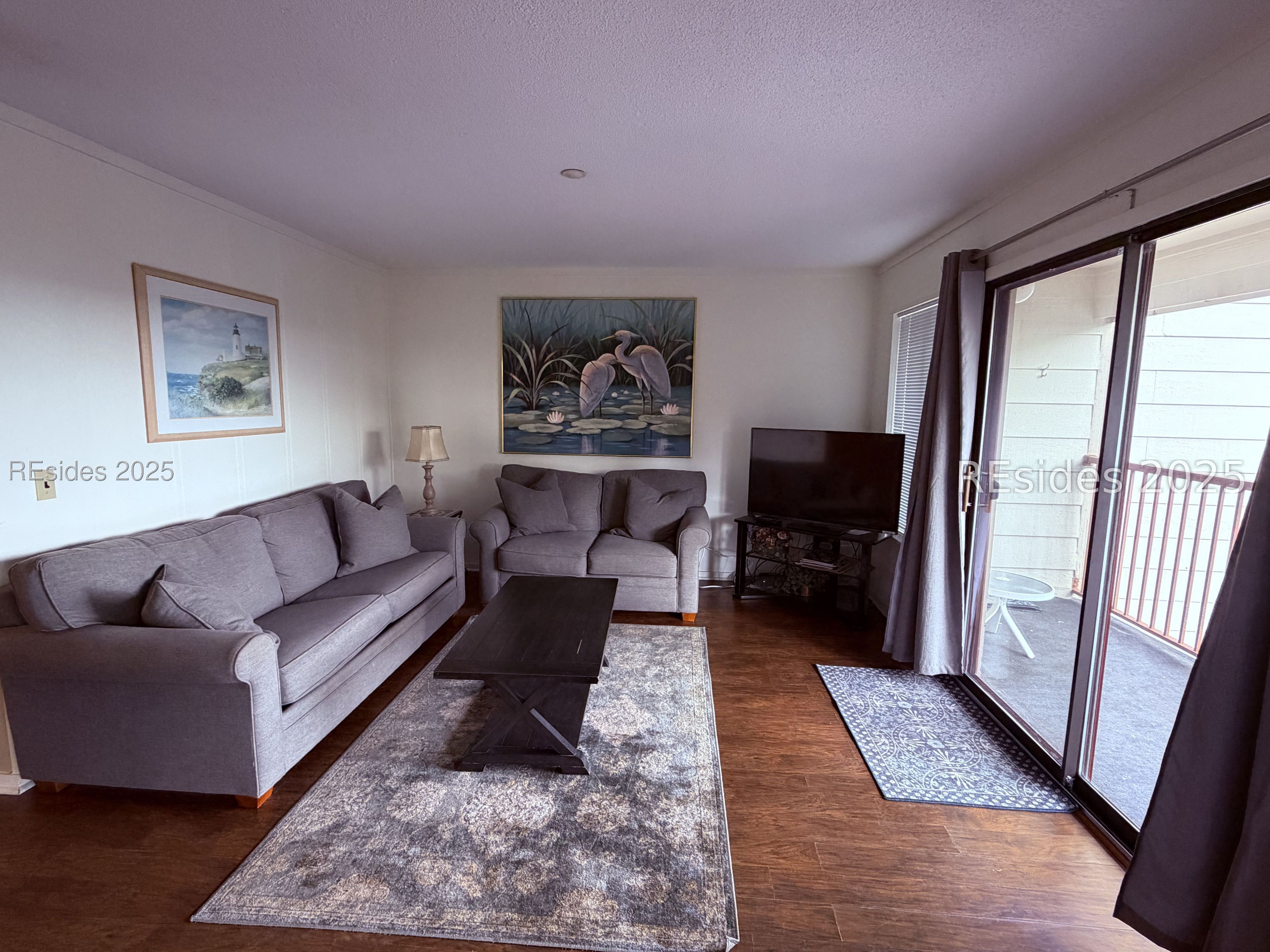 40 Folly Field Road, Unit 329 Hilton Head Island, SC 29928 - Photo 15 of 40 Living area with doors to deck