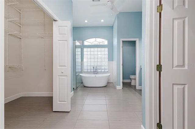 a bathroom with a toilet sink and shower