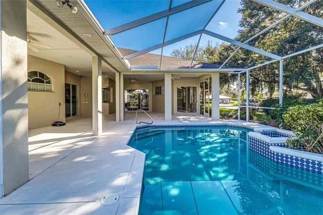 a view of a patio with table and chairs