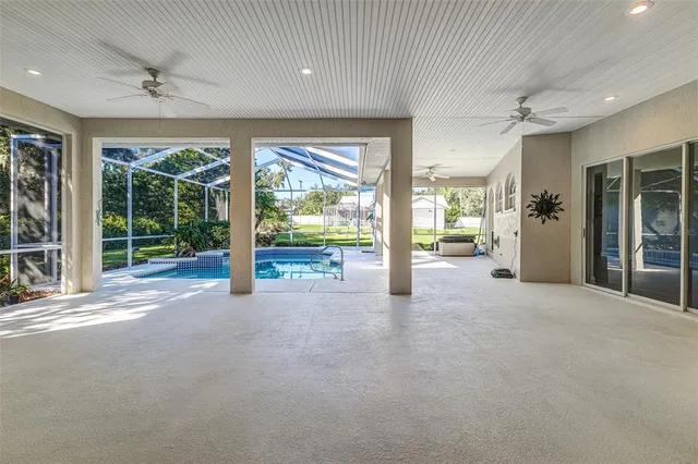 a view of an empty room with windows and a balcony