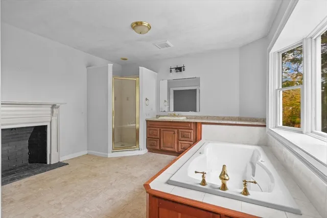 a view of living room with furniture and fireplace