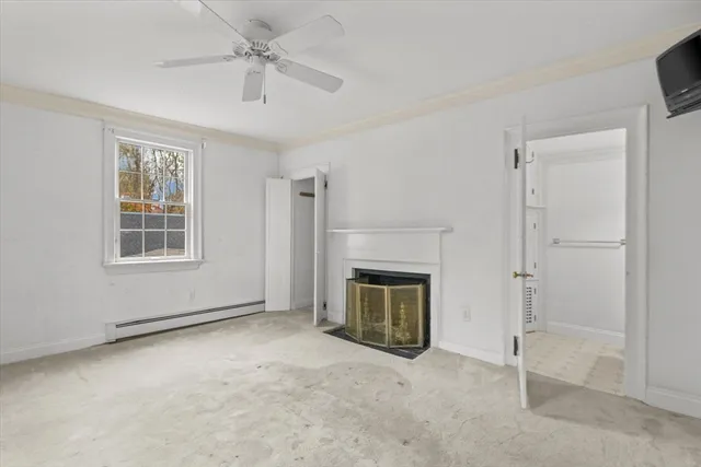 wooden floor fireplace and windows in a room