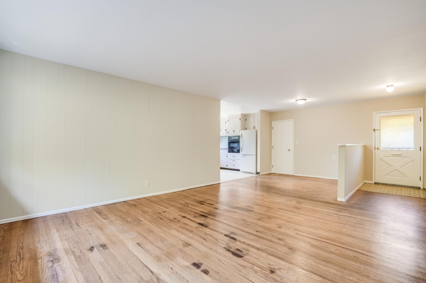 4559 Piper Drive San Jose, CA 95129 - Photo 8 of 30 a view of an empty room with wooden floor and a window