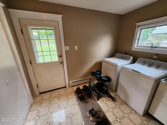 a view of workspace with wooden floor and window