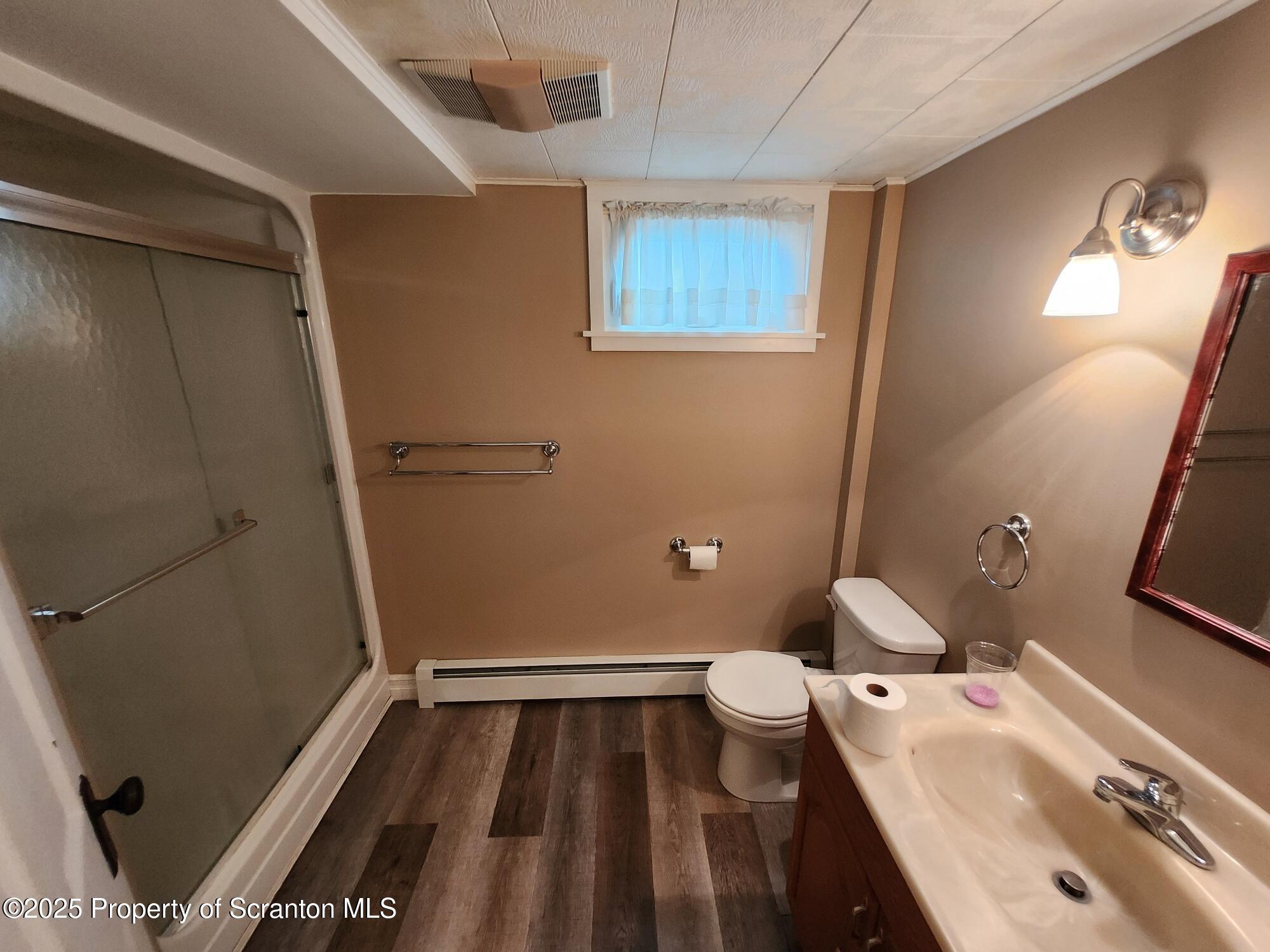 16 Flanagan Street Pringle, PA 18704 - Photo 13 of 33 a bathroom with a sink and a mirror