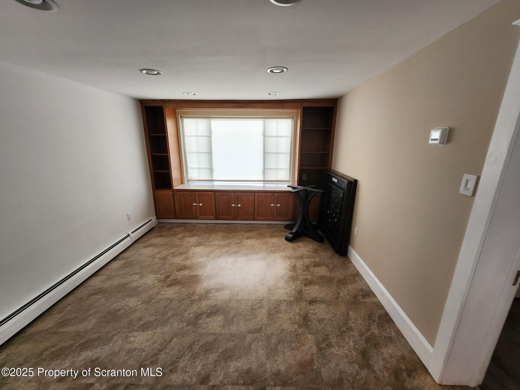 16 Flanagan Street Pringle, PA 18704 - Photo 14 of 33 a room with window and a couch