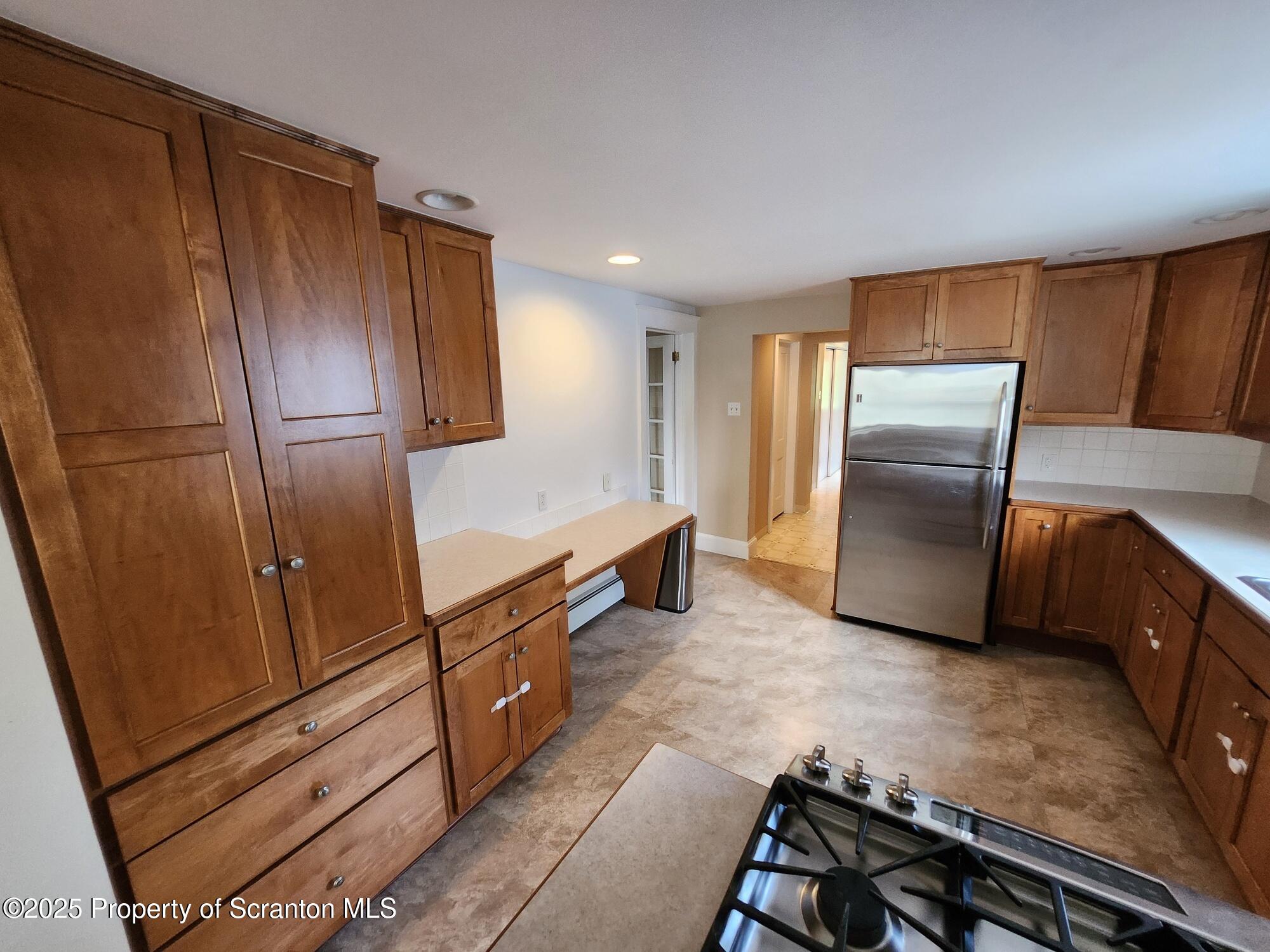 16 Flanagan Street Pringle, PA 18704 - Photo 18 of 33 a kitchen with stainless steel appliances granite countertop a refrigerator and a stove