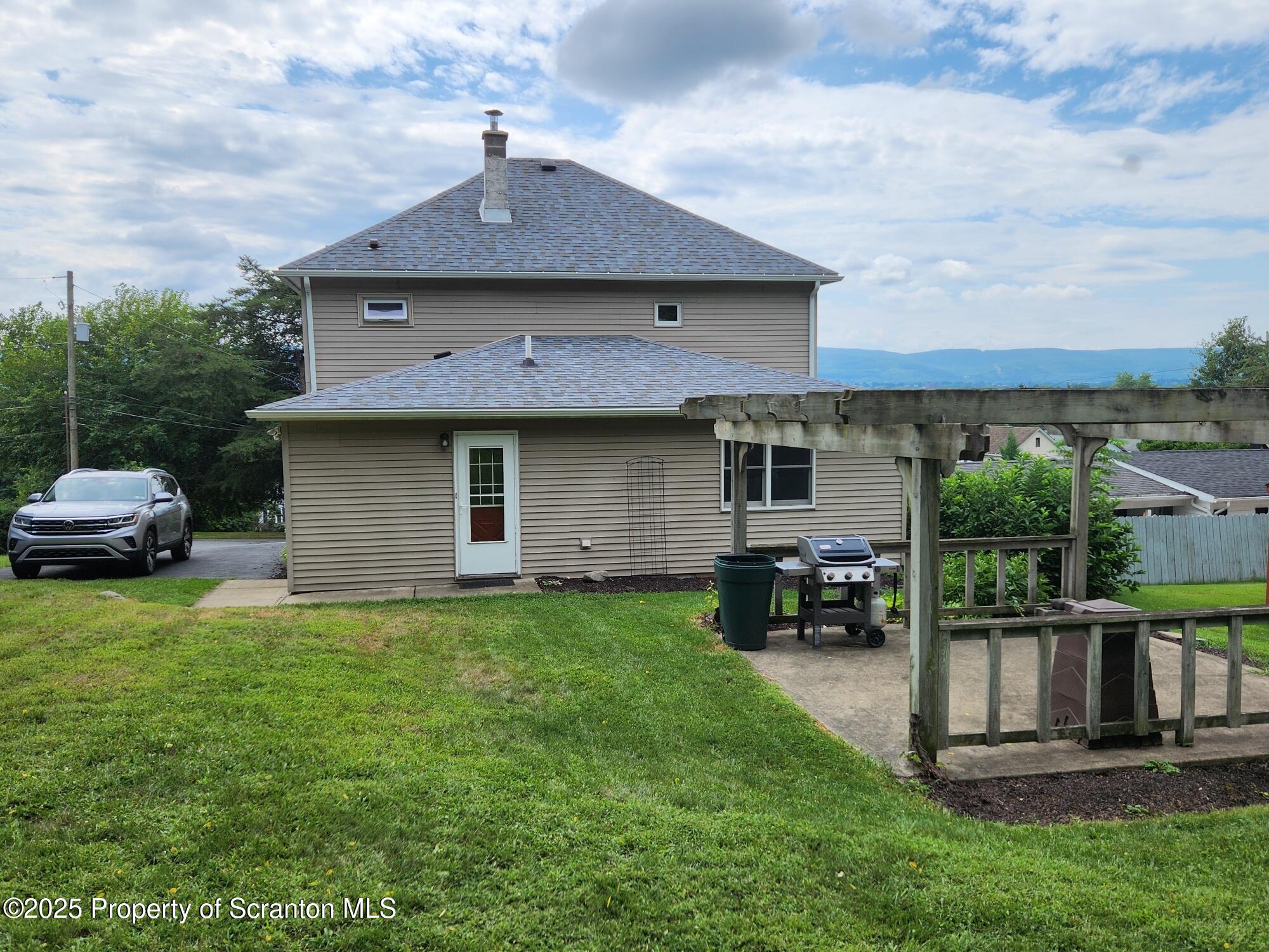 16 Flanagan Street Pringle, PA 18704 - Photo 2 of 33 a front view of a house with a garden and yard