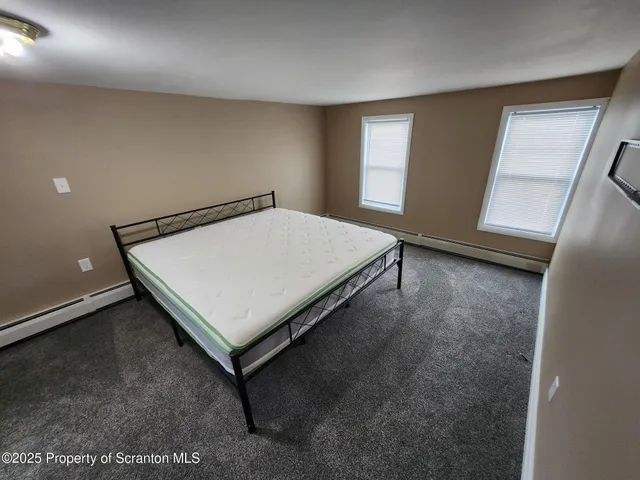 a room with a table and wooden floor