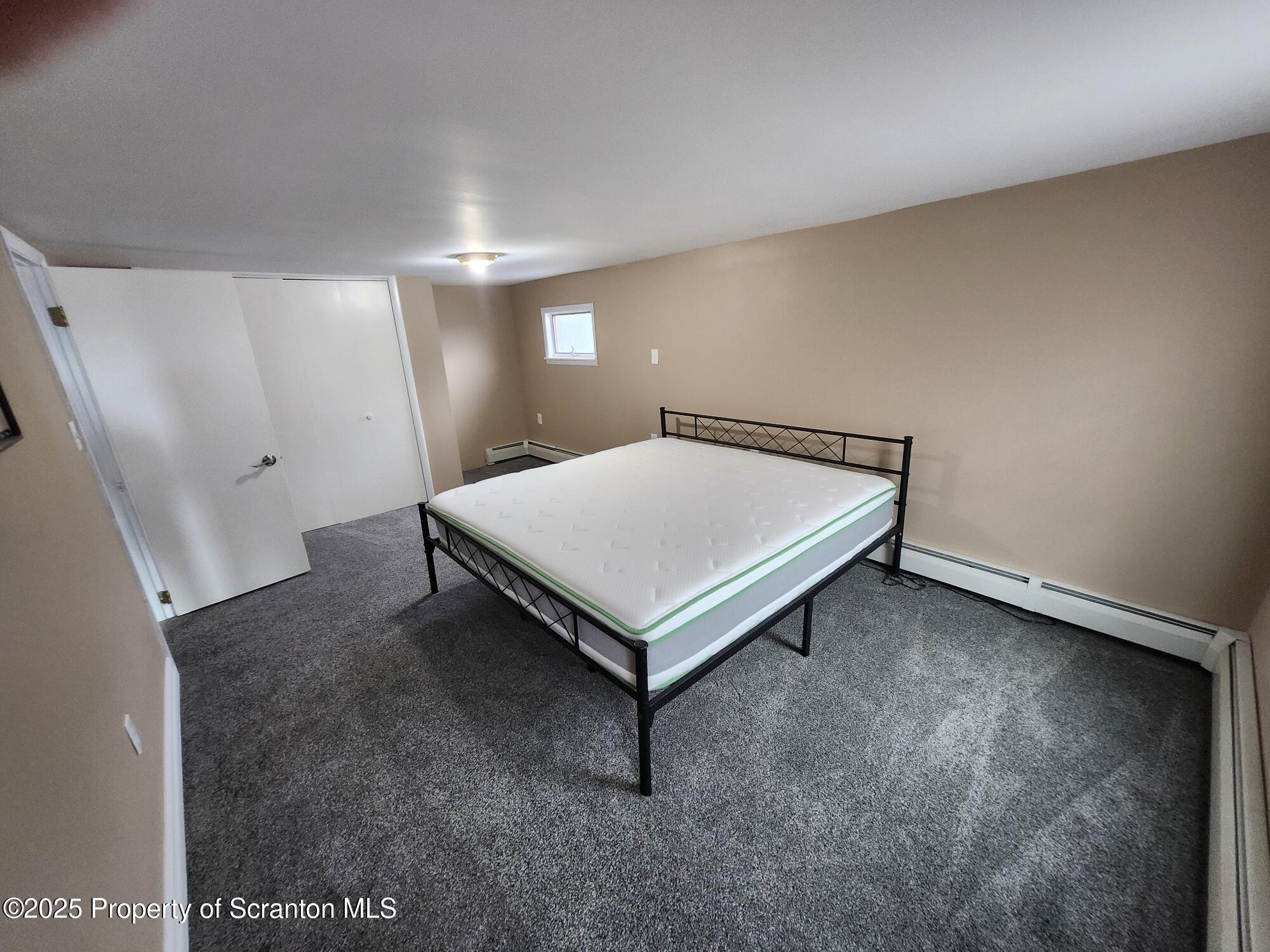 16 Flanagan Street Pringle, PA 18704 - Photo 29 of 33 a room with a table and wooden floor