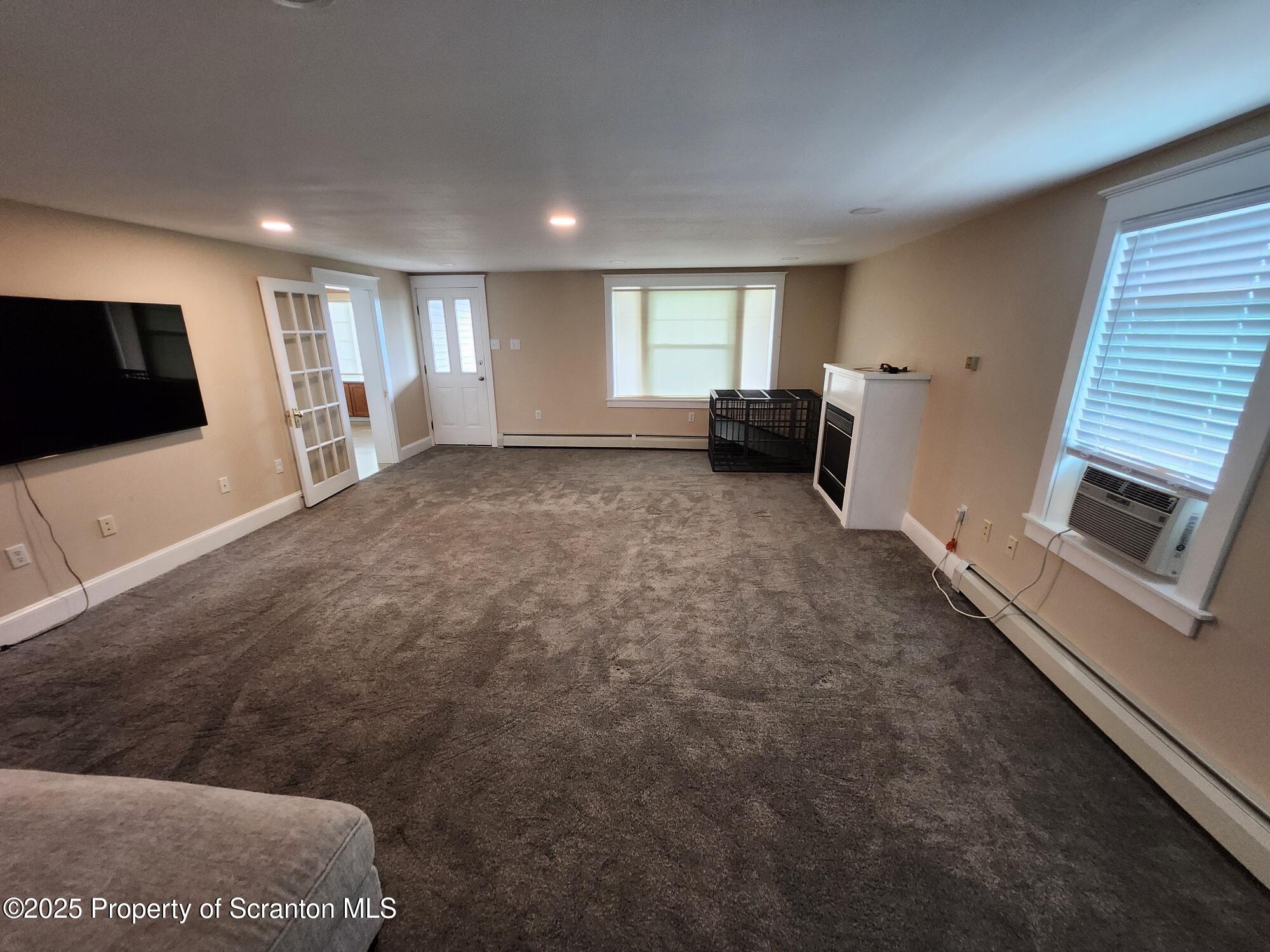 16 Flanagan Street Pringle, PA 18704 - Photo 8 of 33 a view of a livingroom with furniture and a flat screen tv