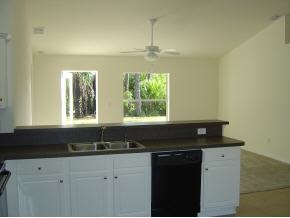 1786 Northwest Rangoon Palm Bay, FL 32907 - Photo 8 of 11 a kitchen with a sink and a window