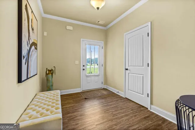 a view of livingroom with hardwood floor and hallway
