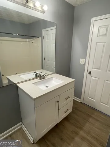 a utility room with cabinets washer and dryer
