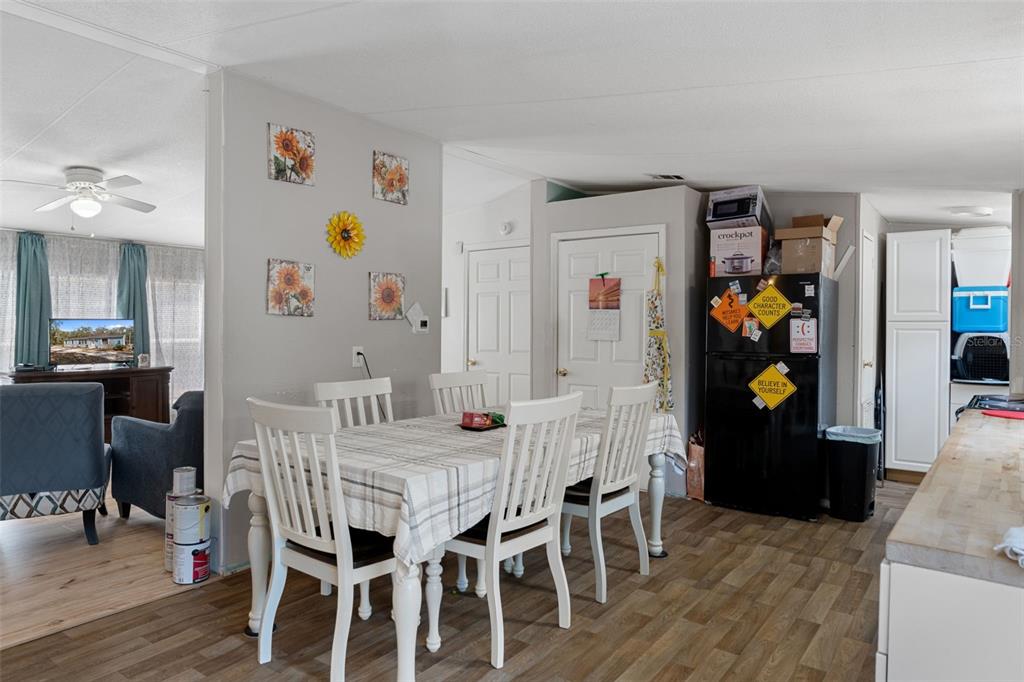 11881 Southwest 45th Street Webster, FL 33597 - Photo 12 of 27 a dining room with furniture and wooden floor