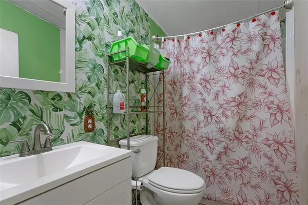 a bathroom with a toilet and a sink