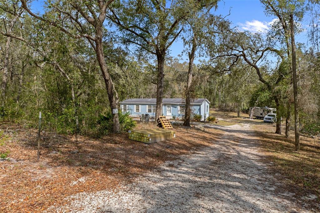 11881 Southwest 45th Street Webster, FL 33597 - Photo 4 of 27 a view of a city with trees