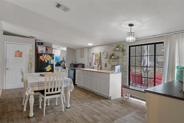 a dining room with furniture and window
