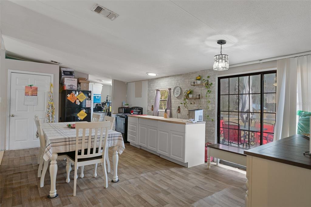 11881 Southwest 45th Street Webster, FL 33597 - Photo 9 of 27 a dining room with furniture and window