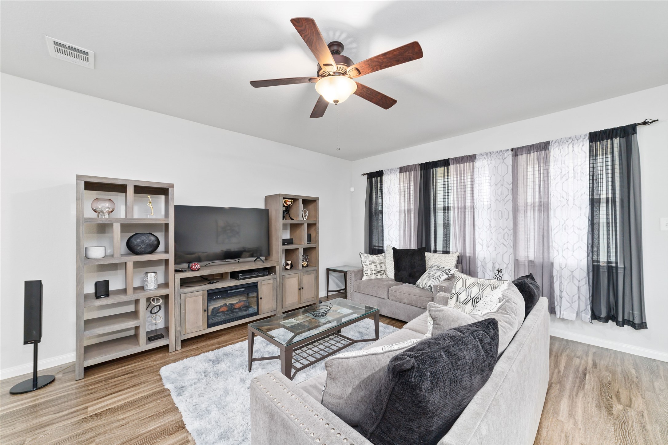 18619 Cooper Ravine Way Katy, TX 77449 - Photo 8 of 23 a living room with furniture and a flat screen tv