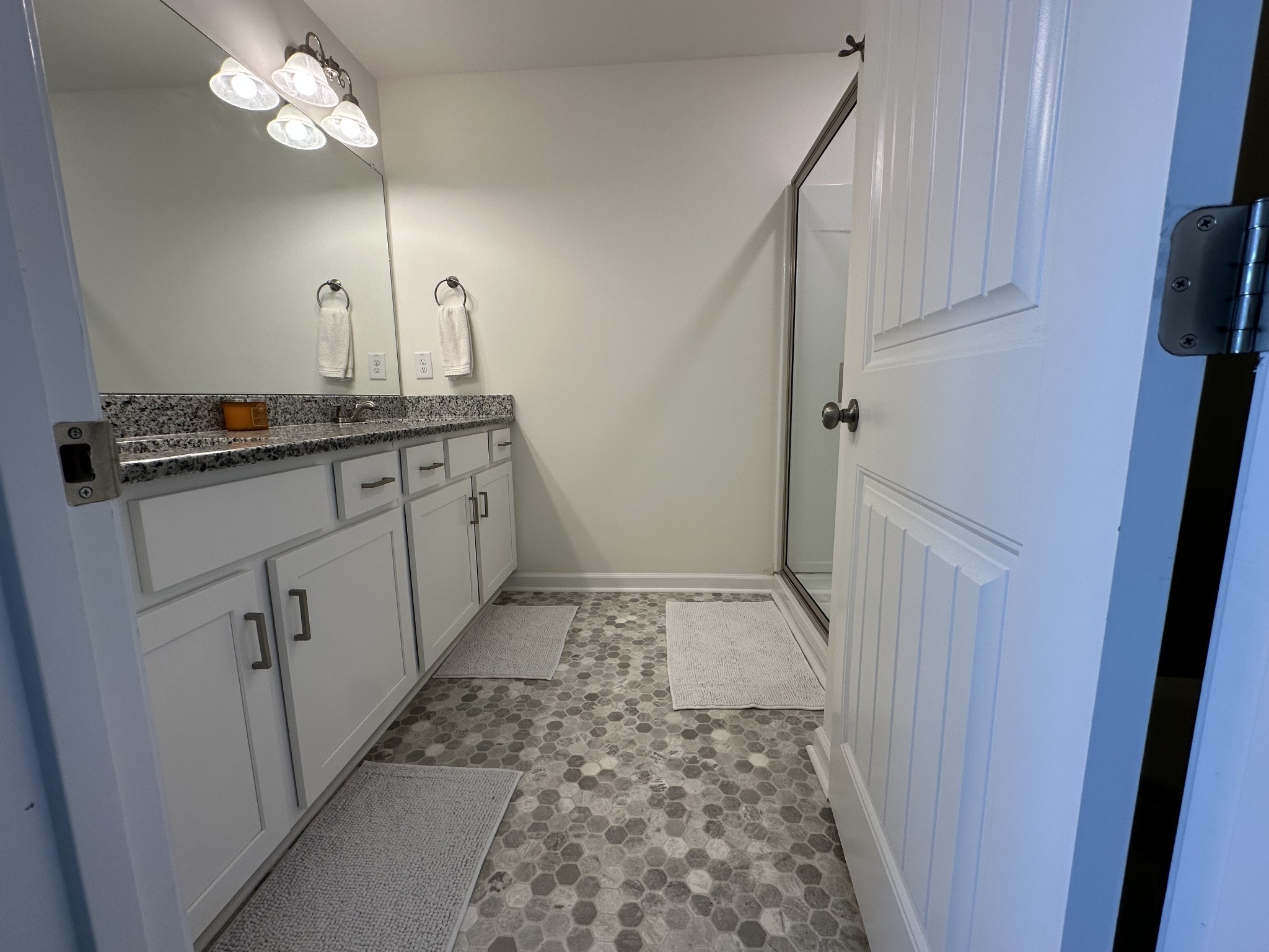 128 Quarry Rdg Road Clarksville, TN 37043 - Photo 11 of 24 a bathroom with a double vanity sink and a mirror