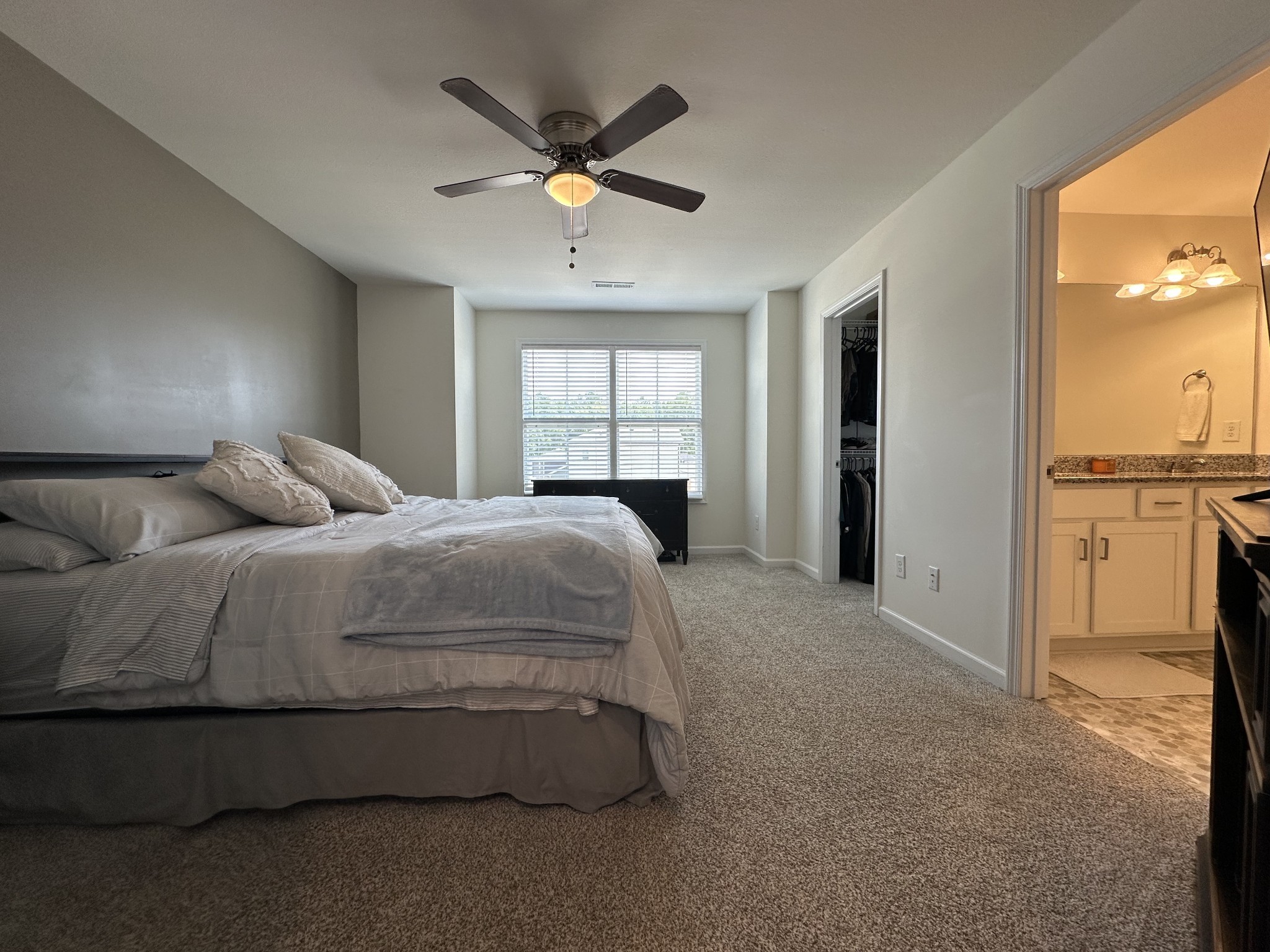 128 Quarry Rdg Road Clarksville, TN 37043 - Photo 15 of 24 a spacious bedroom with a bed and a chandelier