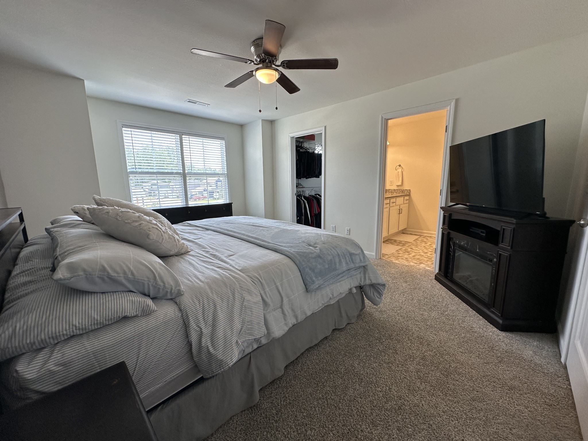 128 Quarry Rdg Road Clarksville, TN 37043 - Photo 16 of 24 a bedroom with a bed and a flat screen tv