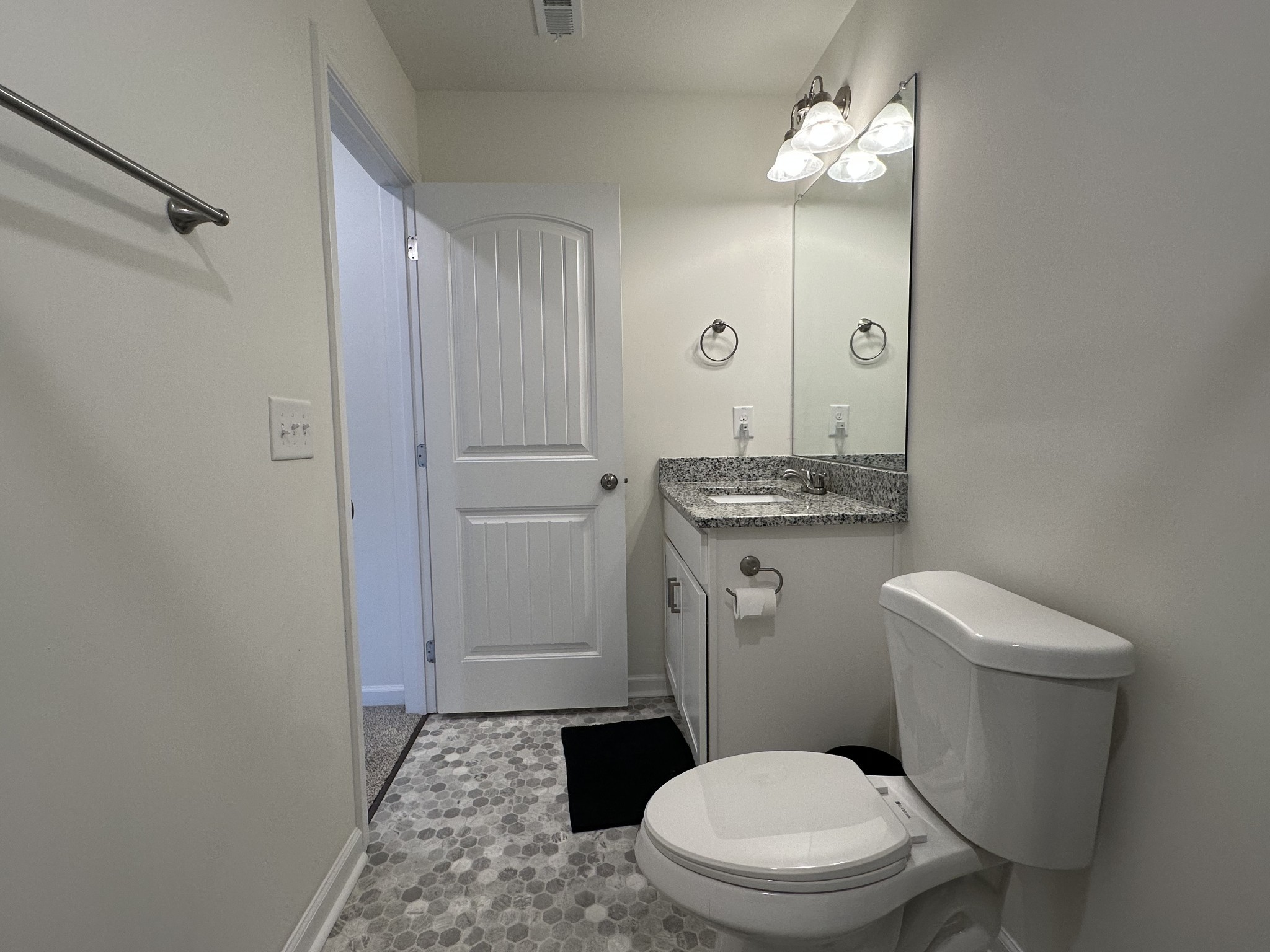128 Quarry Rdg Road Clarksville, TN 37043 - Photo 18 of 24 a bathroom with a granite countertop toilet sink and mirror