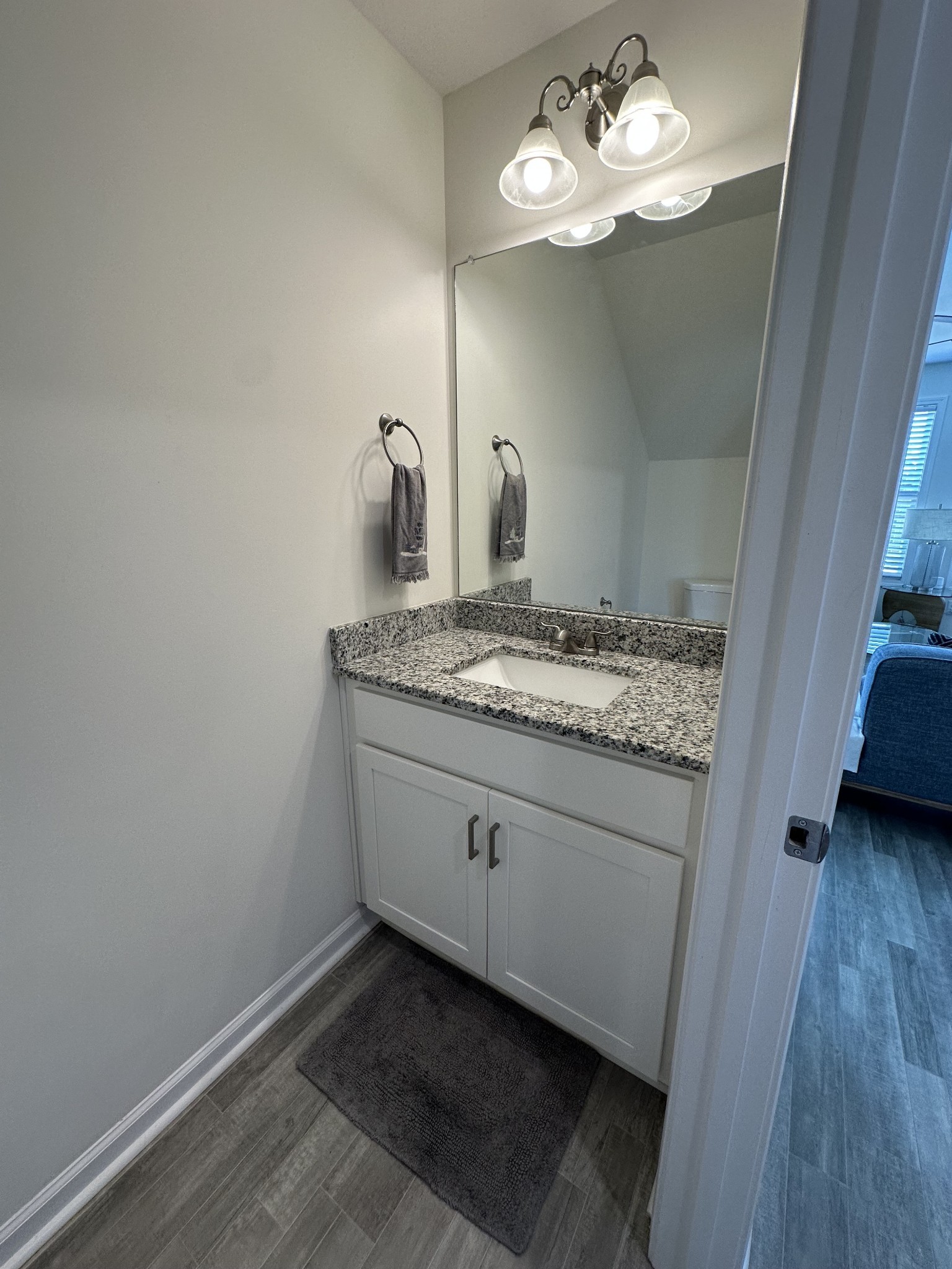 128 Quarry Rdg Road Clarksville, TN 37043 - Photo 21 of 24 a bathroom with a granite countertop sink and a mirror