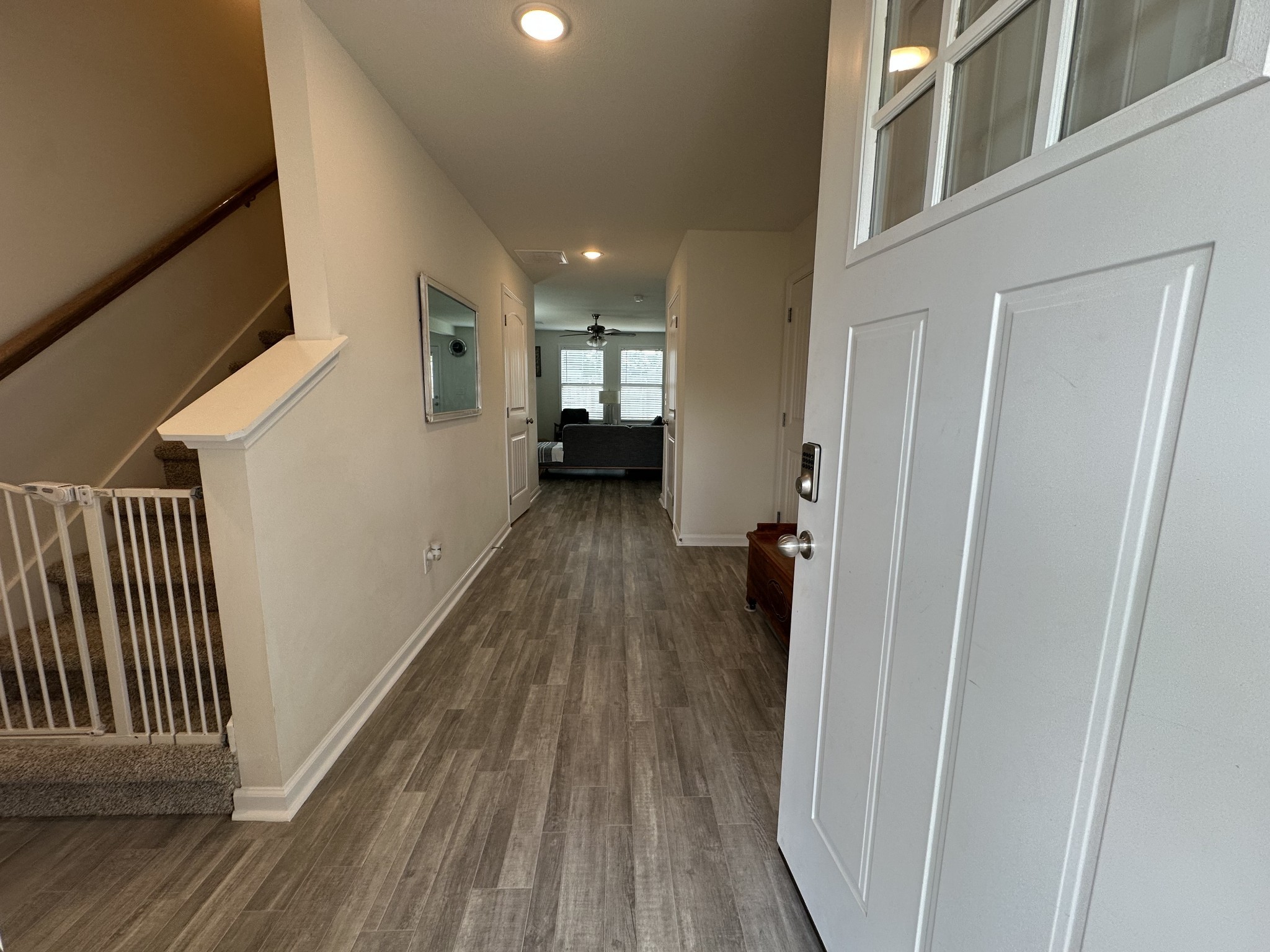128 Quarry Rdg Road Clarksville, TN 37043 - Photo 3 of 24 a view of a hallway with wooden floor and staircase