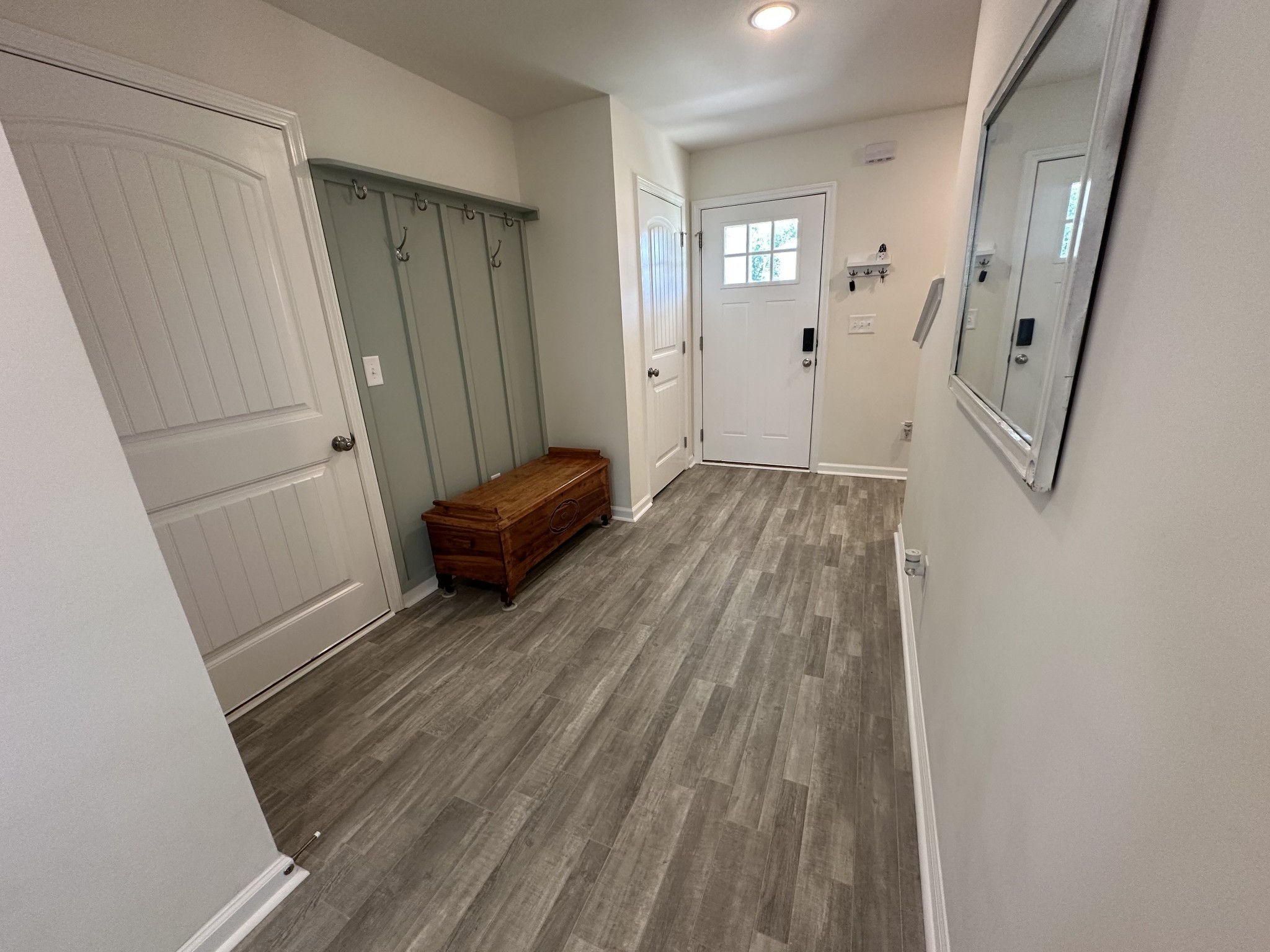 128 Quarry Rdg Road Clarksville, TN 37043 - Photo 4 of 24 a view of a hallway with wooden floor and staircase