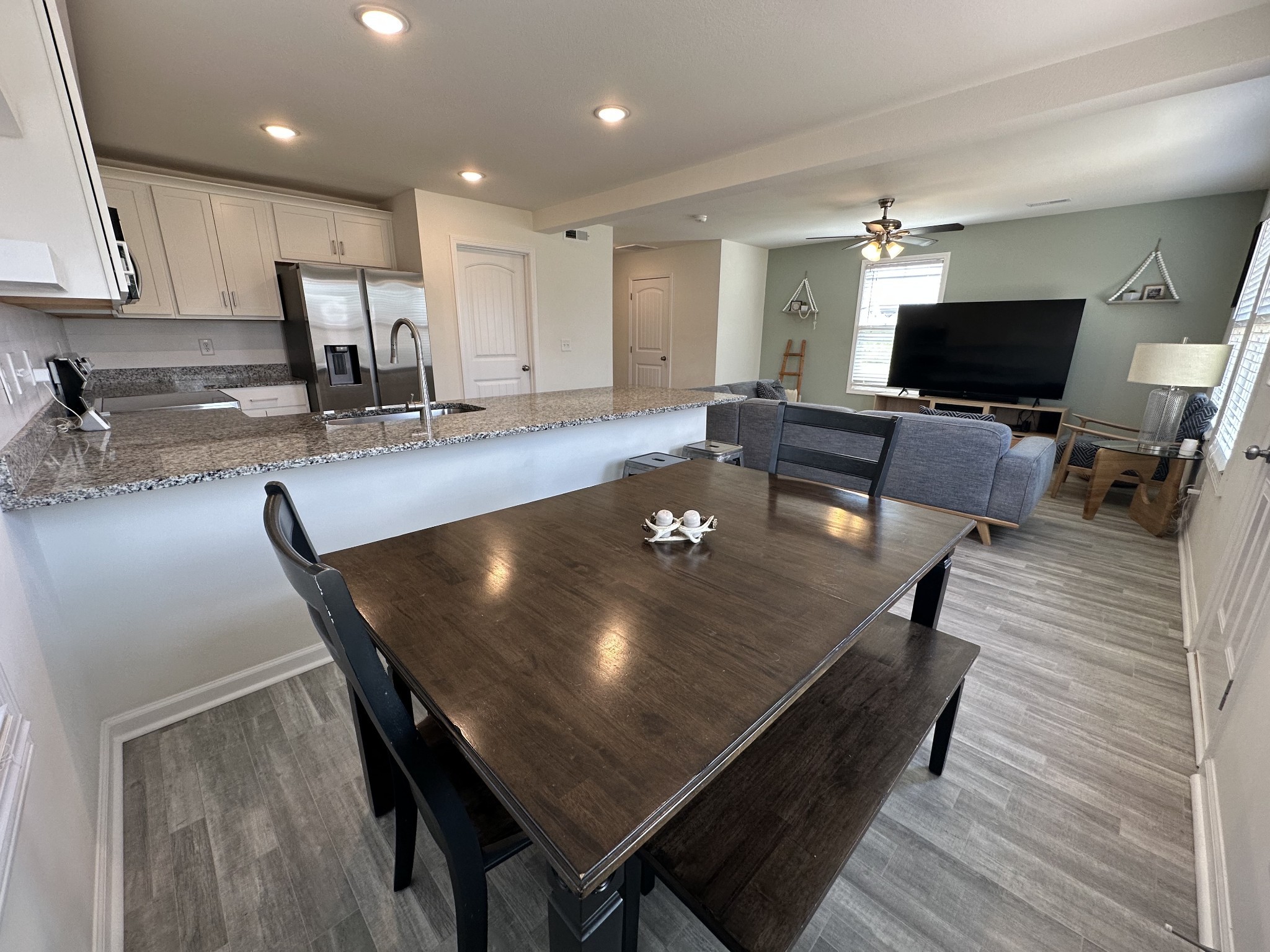 128 Quarry Rdg Road Clarksville, TN 37043 - Photo 8 of 24 a living room with dining room and wooden floor