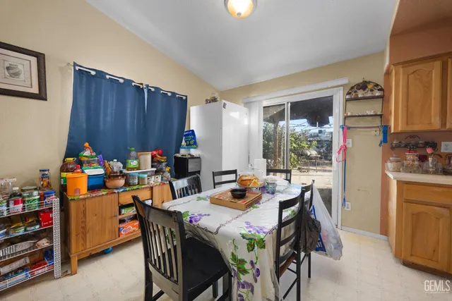 a dining room filled counter top space and a window