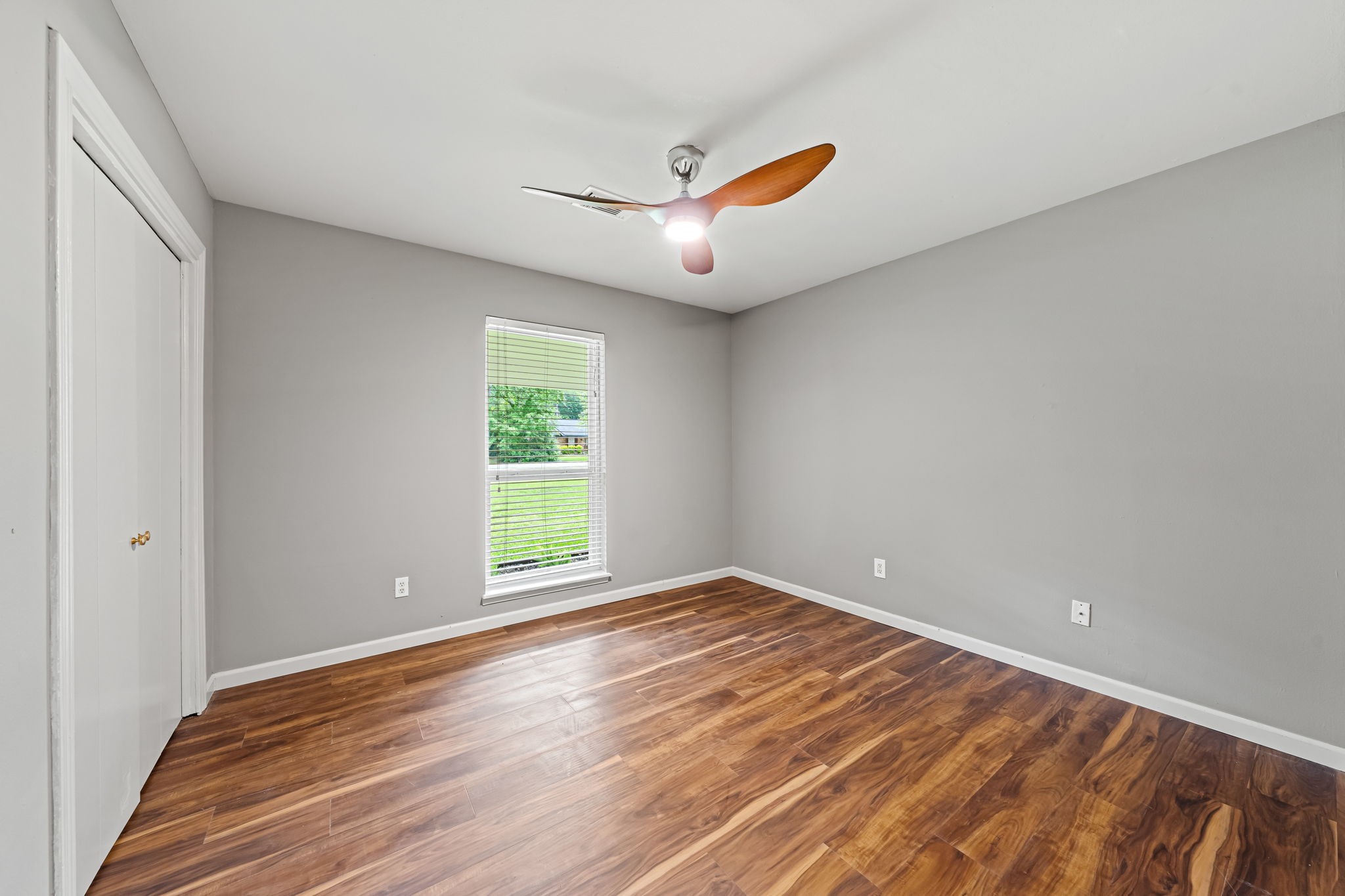 25802 Maplewood Drive Spring, TX 77386 - Photo 20 of 32 wooden floor in an empty room with a window