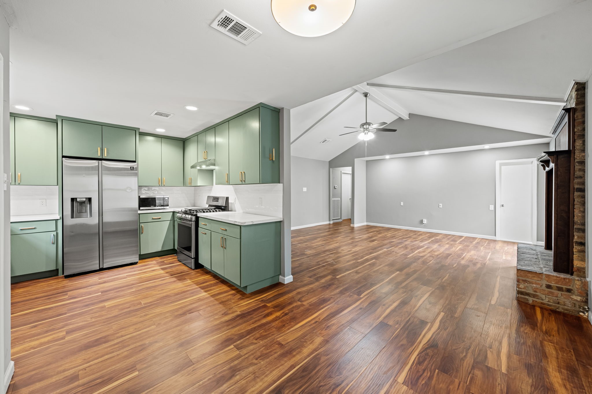 25802 Maplewood Drive Spring, TX 77386 - Photo 2 of 32 a kitchen with stainless steel appliances a sink and a refrigerator