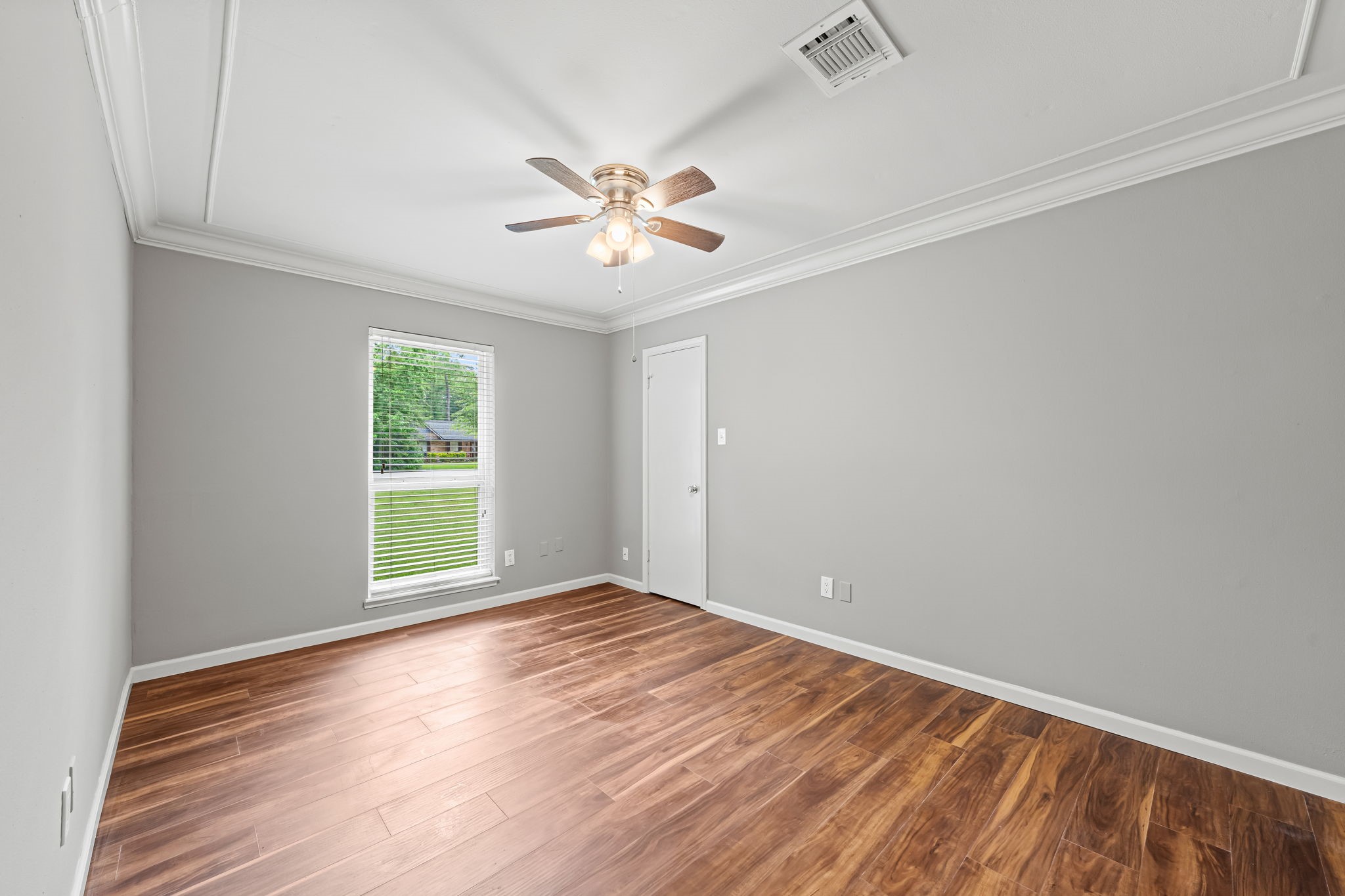 25802 Maplewood Drive Spring, TX 77386 - Photo 21 of 32 wooden floor in an empty room with a window