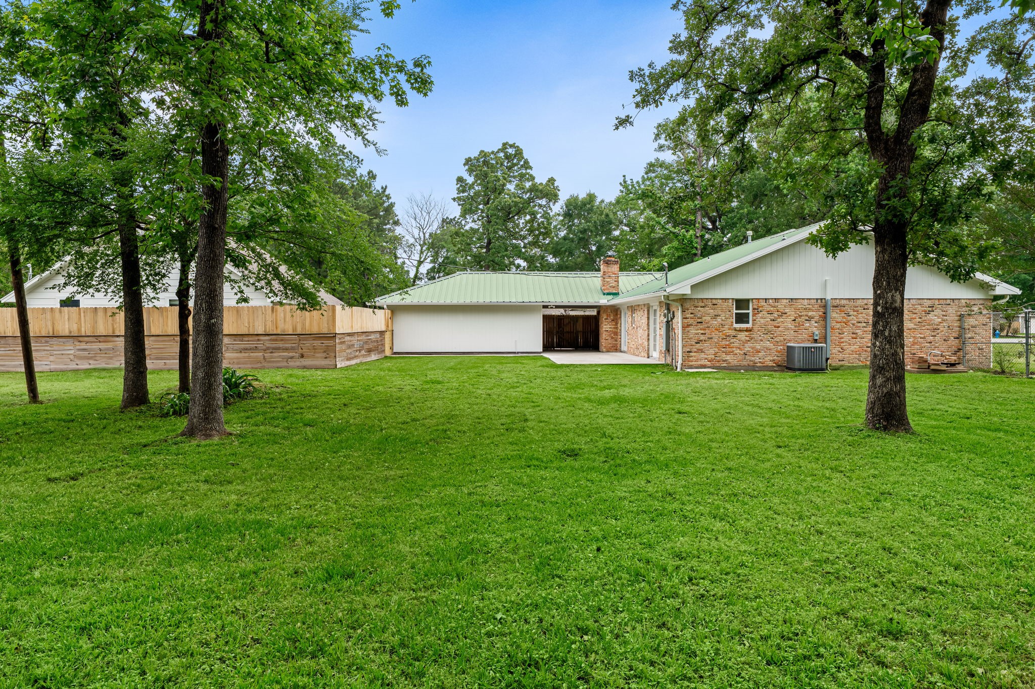25802 Maplewood Drive Spring, TX 77386 - Photo 25 of 32 a view of a house with a yard and tree