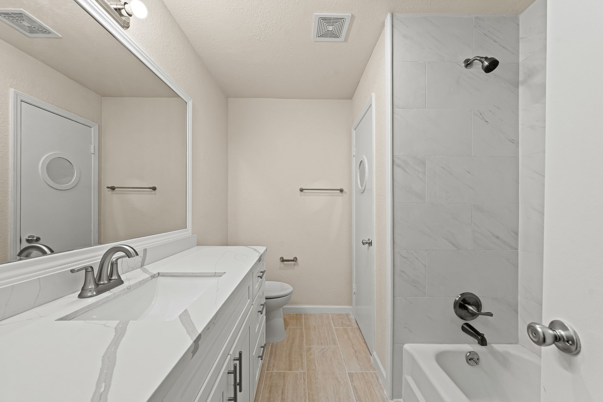 25802 Maplewood Drive Spring, TX 77386 - Photo 4 of 32 a bathroom with a tub sink and mirror