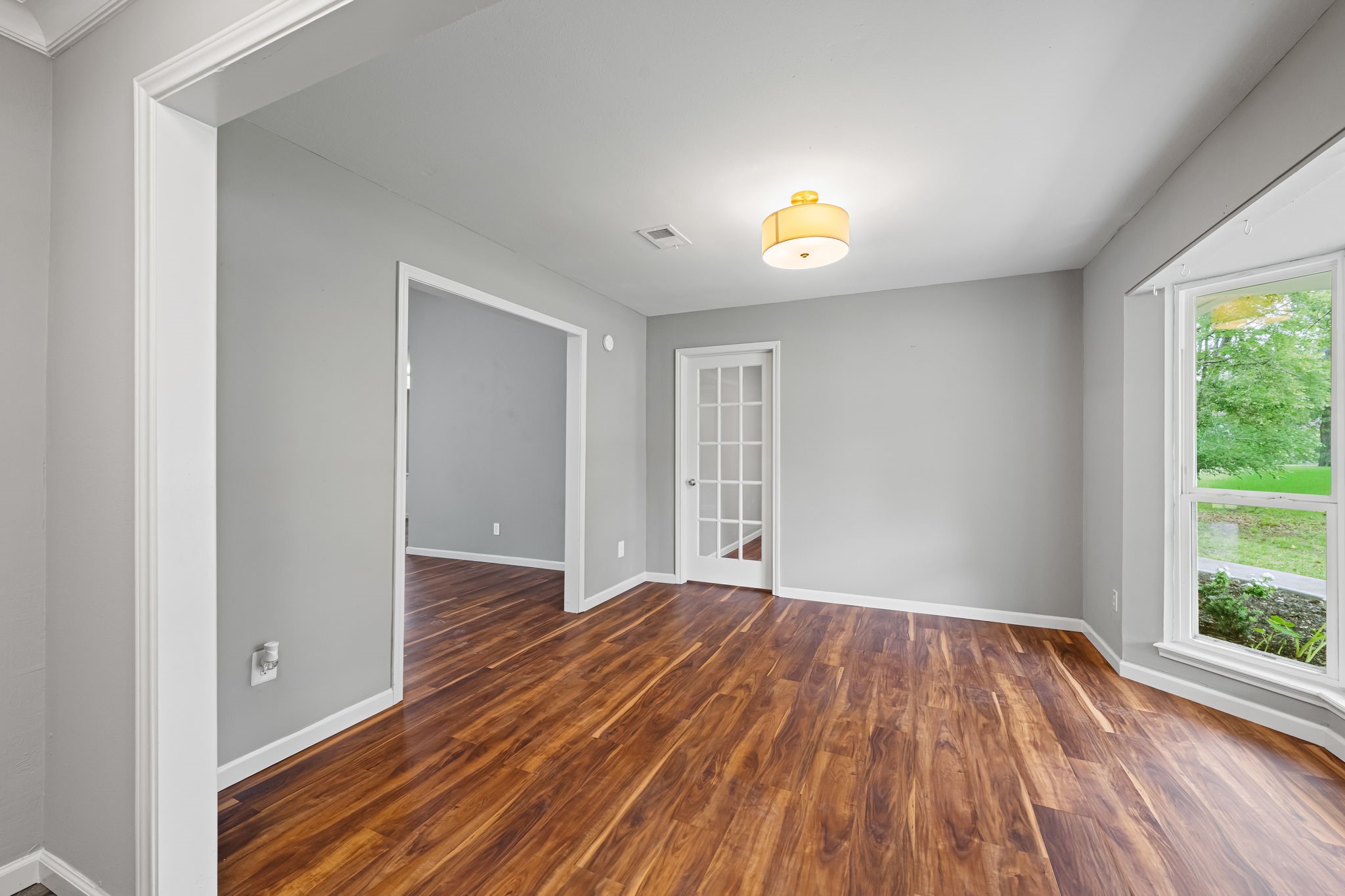 25802 Maplewood Drive Spring, TX 77386 - Photo 9 of 32 a view of empty room with wooden floor and fan