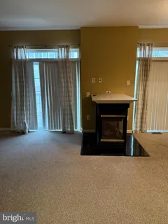 a living room with a fireplace