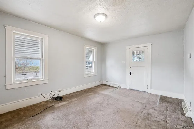 an empty room with windows