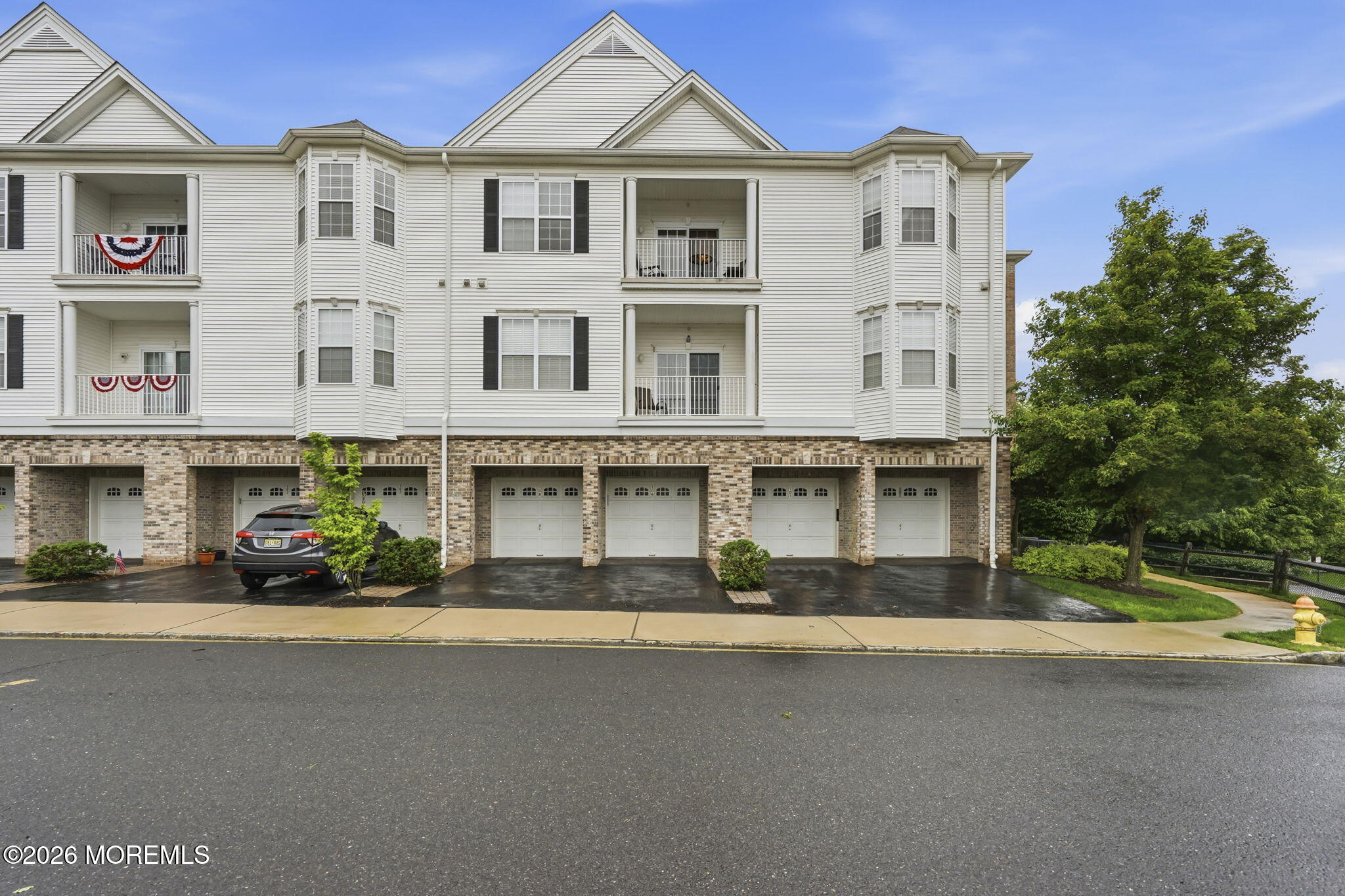 106 Potts Road Morganville, NJ 07751 - Photo 2 of 25 a car parked in front of a building
