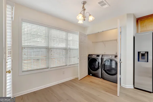 a view of a room with washer and dryer