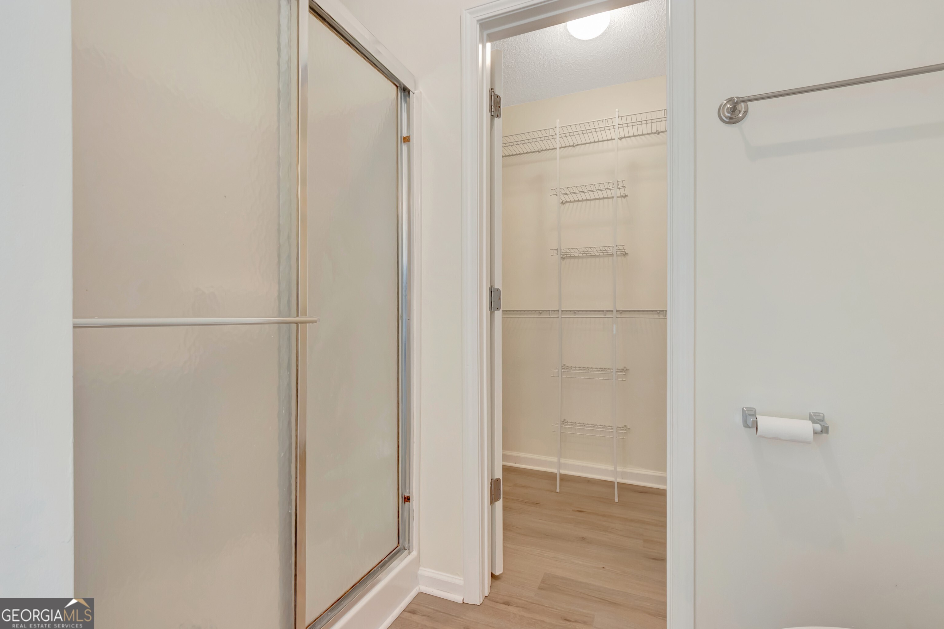 503 Hunterian Place Newnan, GA 30265 - Photo 23 of 28 a bathroom with a glass shower door