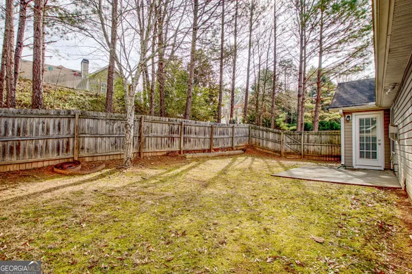 a view of a yard with basketball court