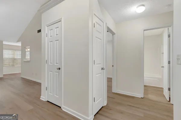 a view of entryway with wooden floor
