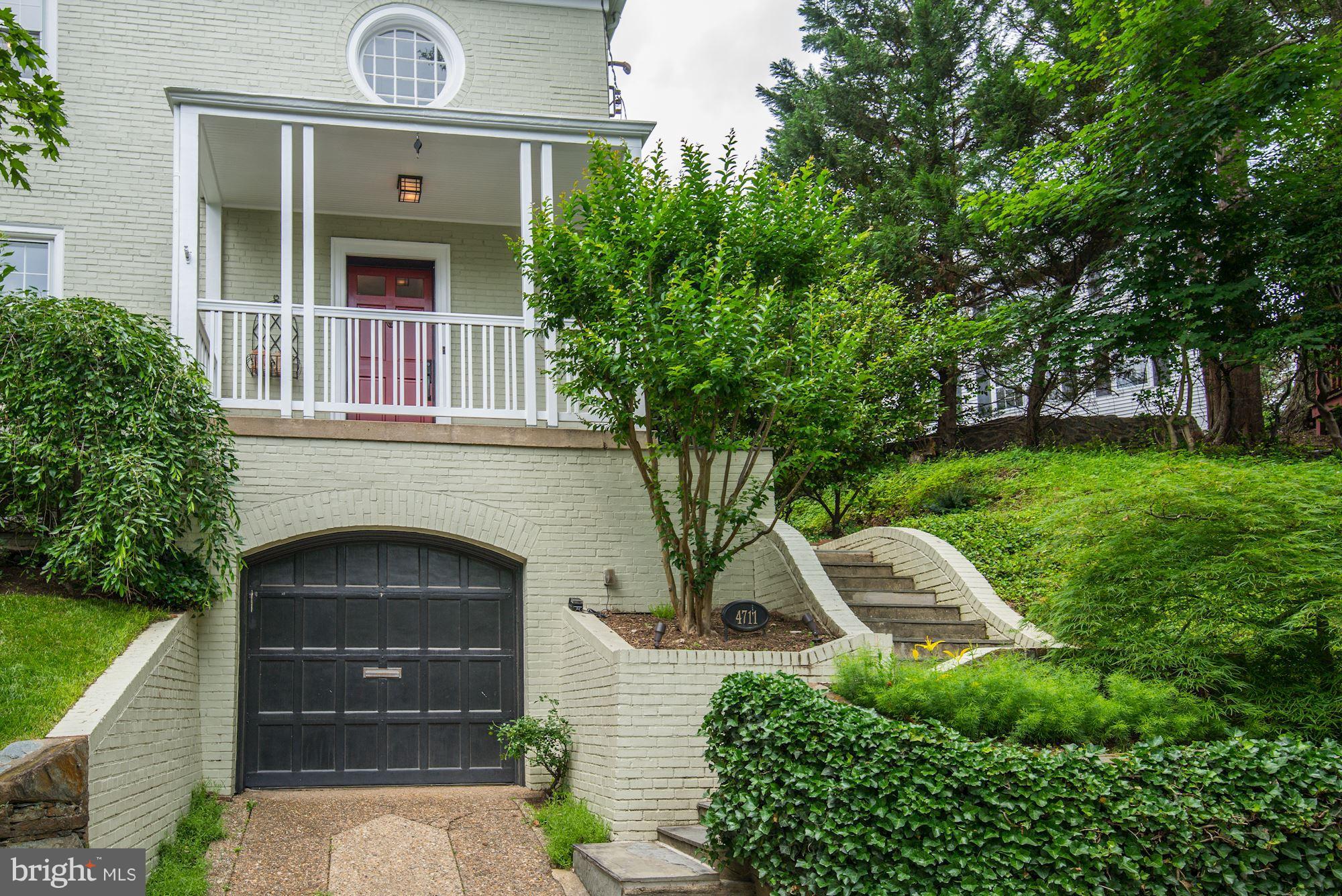 4711 Reservoir Road Northwest Washington, DC 20007 - Photo 2 of 30 Front exterior with large garage