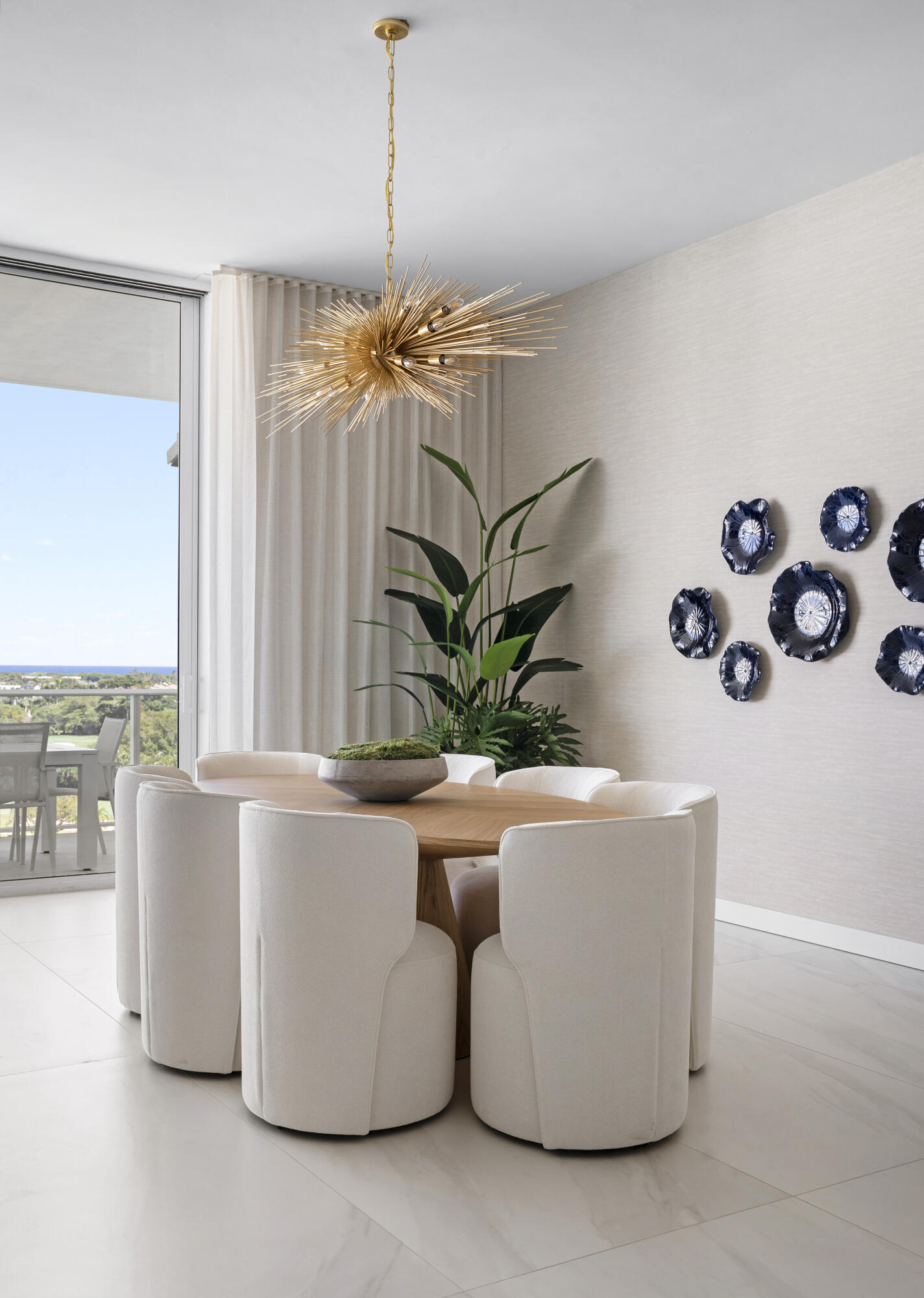 220 Southeast Mizner Boulevard, Unit PH921 Boca Raton, FL 33432 - Photo 11 of 21 a white vase with flowers sitting on a table