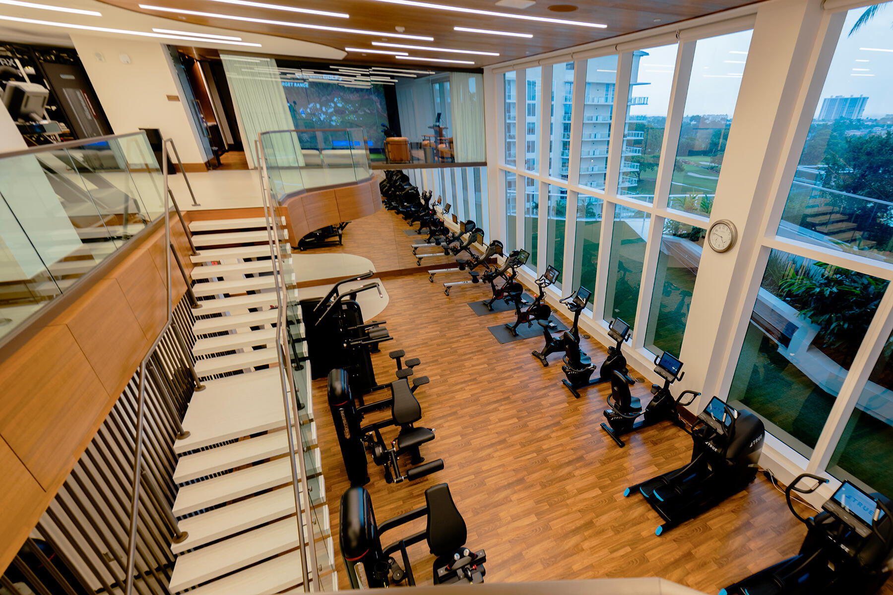 220 Southeast Mizner Boulevard, Unit PH921 Boca Raton, FL 33432 - Photo 19 of 21 a view of a hallway with wooden floor and staircase