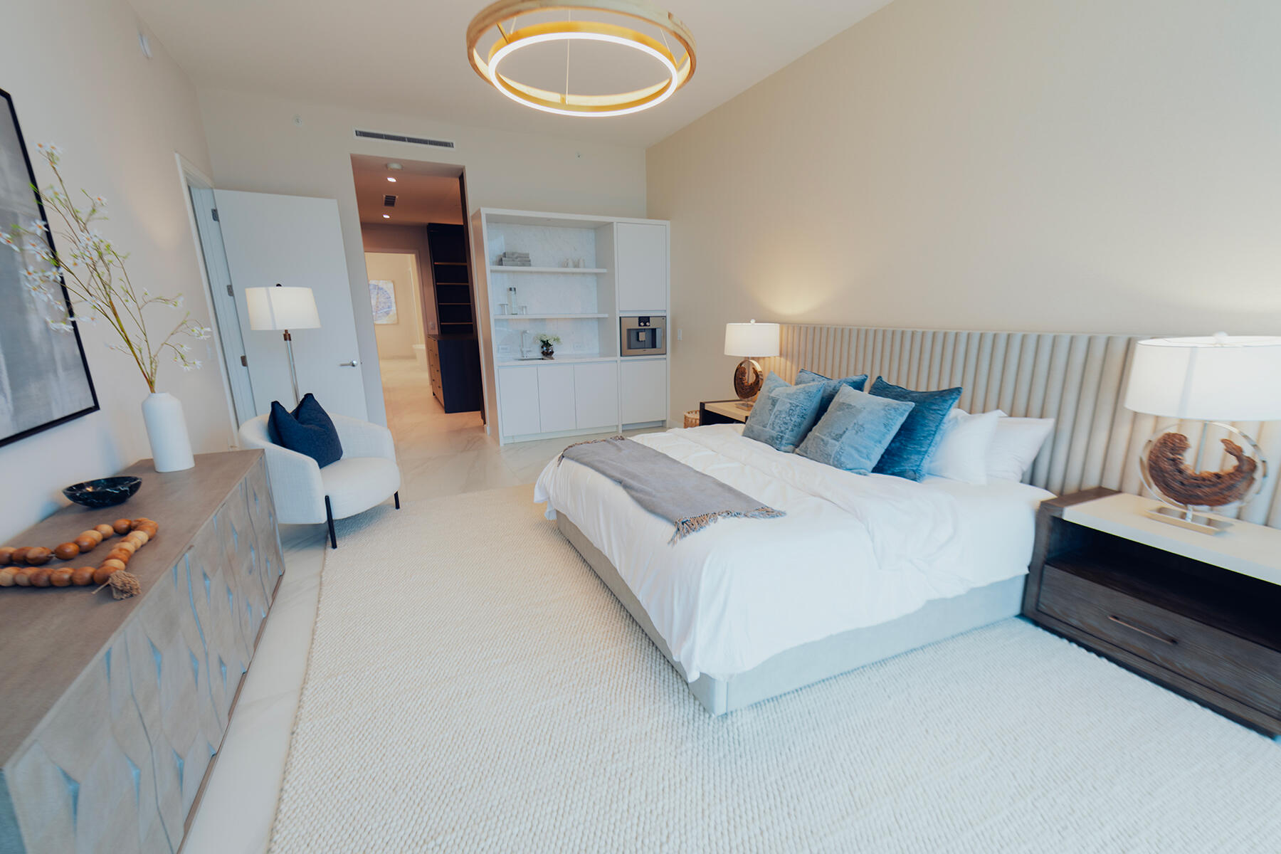 220 Southeast Mizner Boulevard, Unit PH921 Boca Raton, FL 33432 - Photo 6 of 21 a bedroom with a bed and a couch